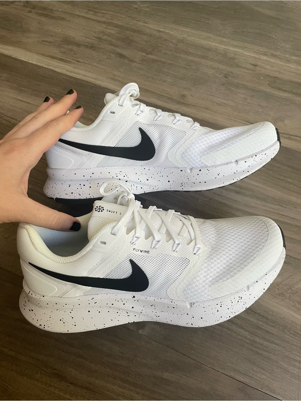 Nike Women’s White Athletic Sneakers with Black Swoosh